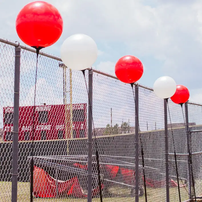 Single reusable balloons mounted at a college stadium. 