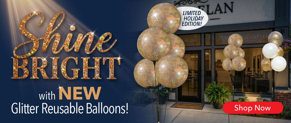SHINE bright with New Glitter Reusable Balloons &ndash; Limited Holiday Edition! Three reusable balloon clusters with glitter balloons outside of a business. 