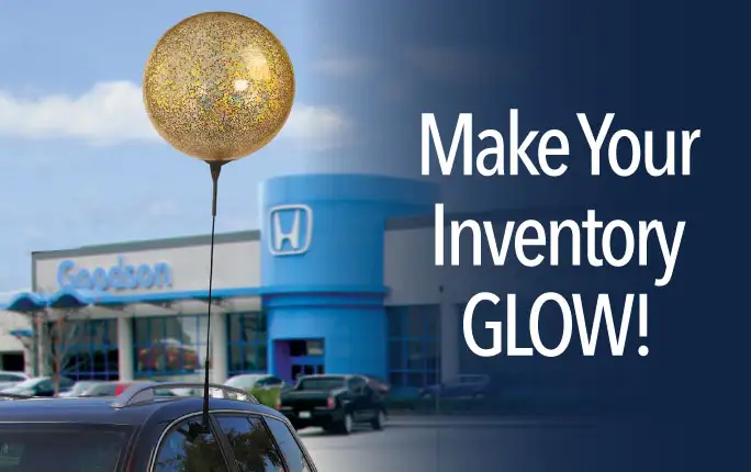 Make inventory GLOW! Glitter reusable balloon car window clip attached to a dealership car.