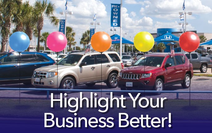 Highlight Your Business Better! Colorful and bright Single Pole Balloons in front of a car shop.