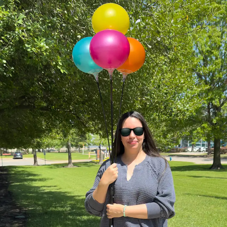 4 Balloon Clusters with 8" Vinyl Balloons placed outdoors.